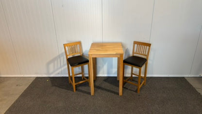 Begagnat träfärgat IKEA barbord med läderstolar