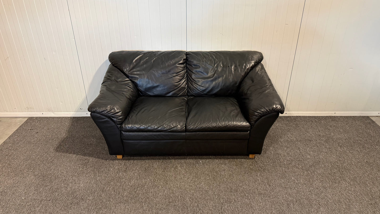 Begagnad svart 2-sits lädersoffa