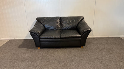 Begagnad svart 2-sits lädersoffa