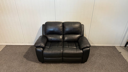 Begagnad svart 2-sits lädersoffa med mönster