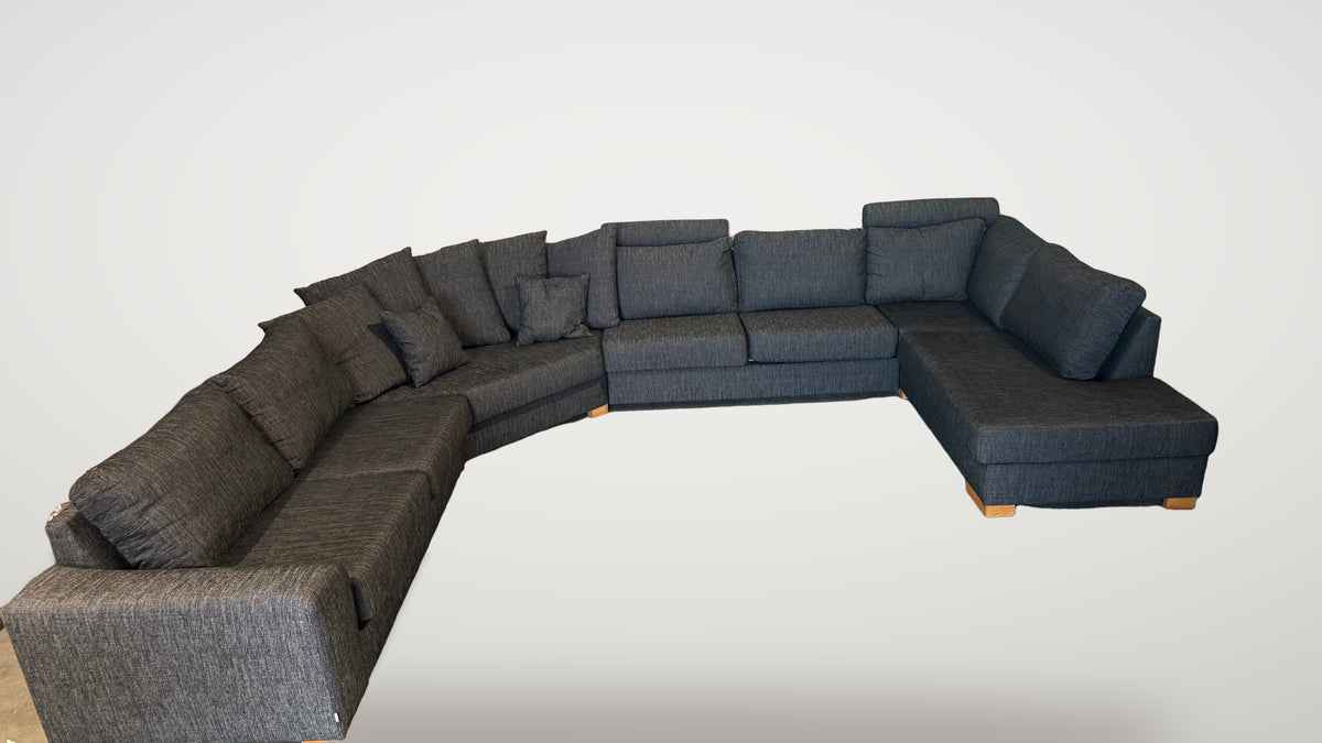 Begagnad svart Bellus U-soffa helhetsbild